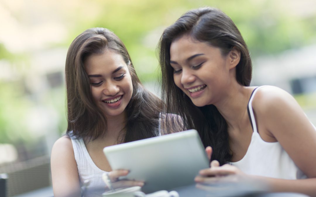 Students with a tablet computer